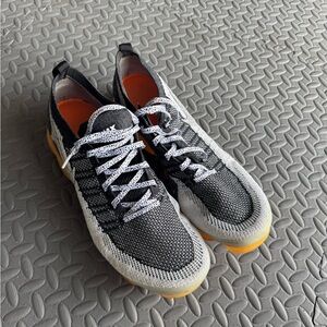 Nike Black and White Sneakers with Orange Accents